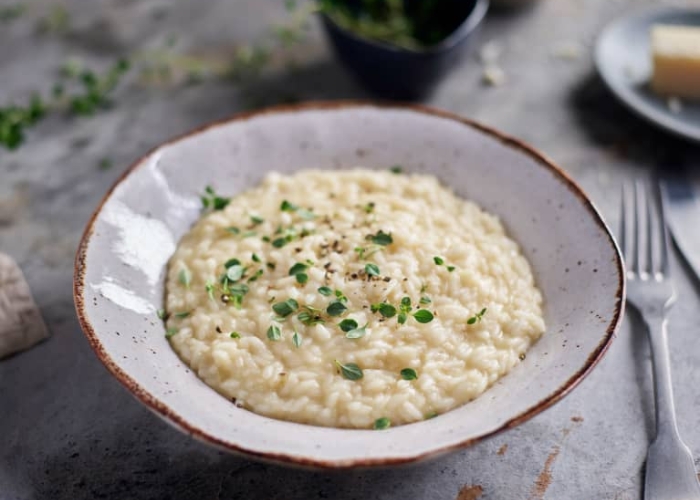 Kinh nghiệm du lịch Venice Ý - Risotto là món cơm Ý được nấu với nước dùng, pho mát và các nguyên liệu khác